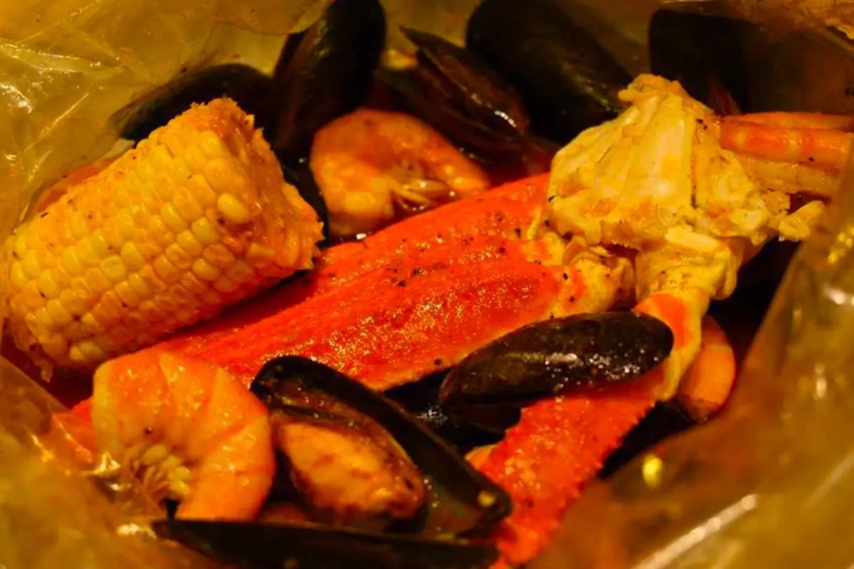 Snow crab shrimp mussel and corn seasoned seafood boil mix at Red Crab Juicy Seafood, a Seafood Restaurant in Brooklyn