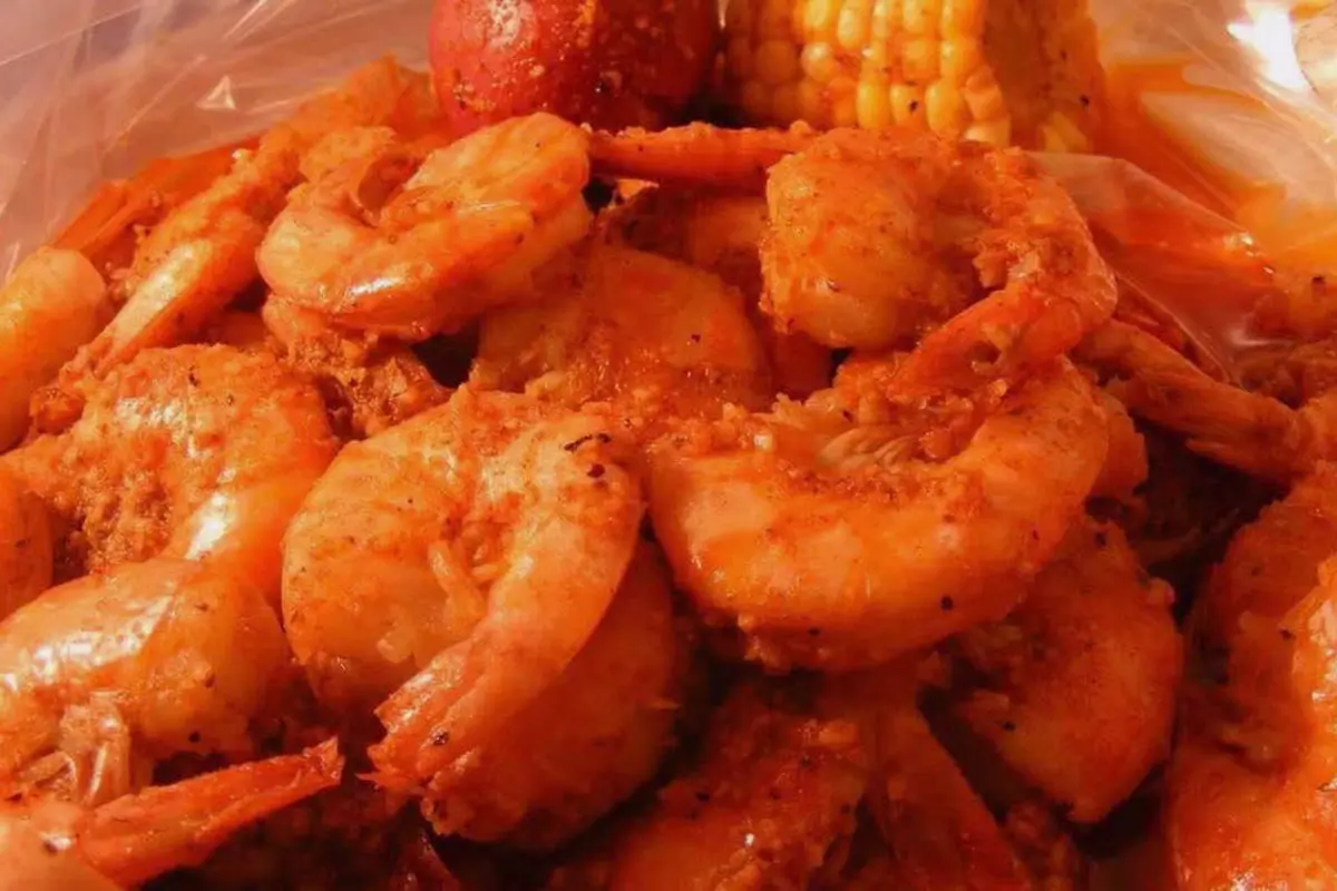 Heap of seasoned boiled large juicy peeled shrimp at Red Crab Juicy Seafood, a Seafood Restaurant in Brooklyn